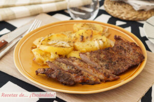 Secreto ibérico de cerdo al horno con patatas asadas